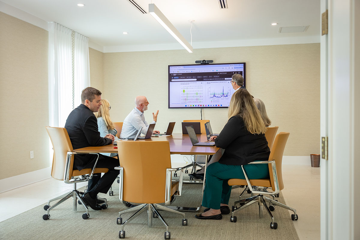 group of people looking at screen